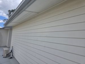 House exterior weatherboard wall after soft washing