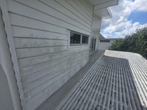 Timber deck and house wall soft washing progress