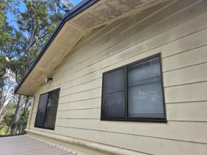House eave before soft washing, close-up